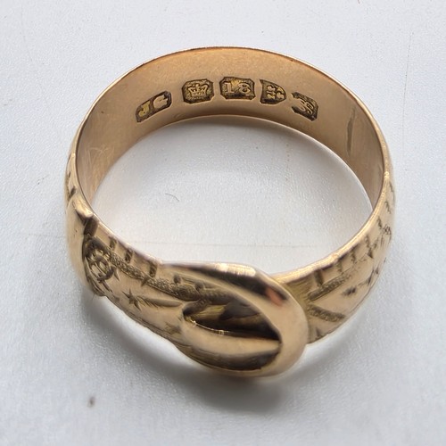 47 - An 18ct gold buckle ring. Size N. 5.6g