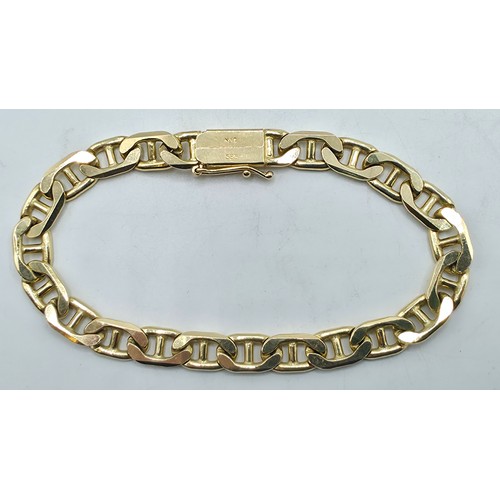41 - A 15ct gold flat fancy link bracelet. 19cm. 20.6g