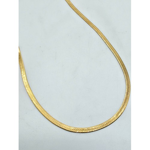 52 - A 9ct gold flat fancy link necklace 39cm. 2.6g.