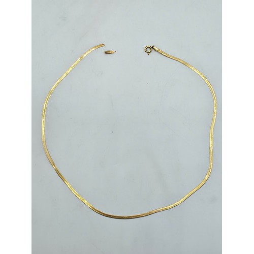 52 - A 9ct gold flat fancy link necklace 39cm. 2.6g.