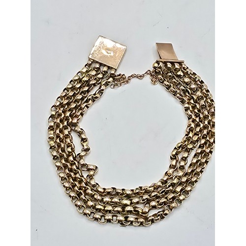 42 - A 9ct gold four strand curb link bracelet 20cm. 12.4g