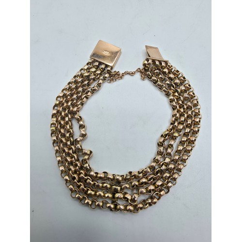 42 - A 9ct gold four strand curb link bracelet 20cm. 12.4g