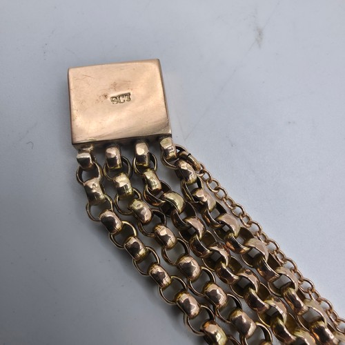 42 - A 9ct gold four strand curb link bracelet 20cm. 12.4g