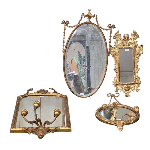 310 - Four decorative gilt wall mirrors