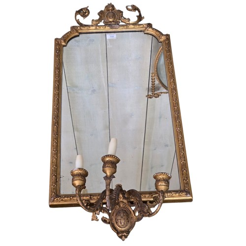 310 - Four decorative gilt wall mirrors