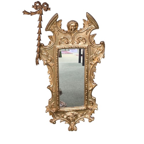 310 - Four decorative gilt wall mirrors
