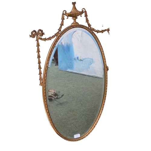 310 - Four decorative gilt wall mirrors