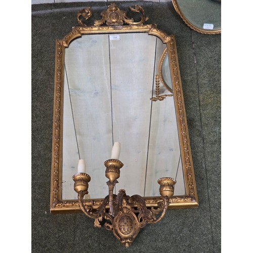 310 - Four decorative gilt wall mirrors