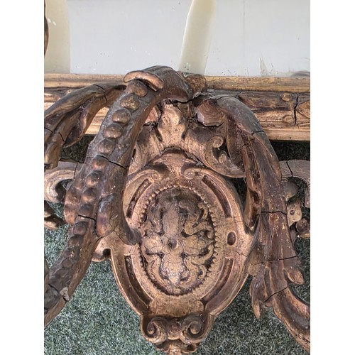 310 - Four decorative gilt wall mirrors