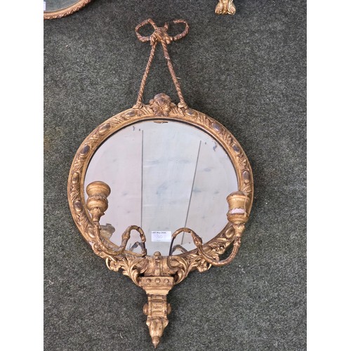 310 - Four decorative gilt wall mirrors