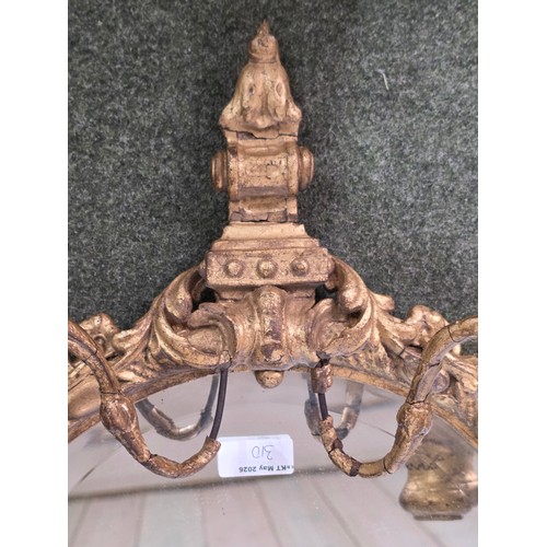 310 - Four decorative gilt wall mirrors