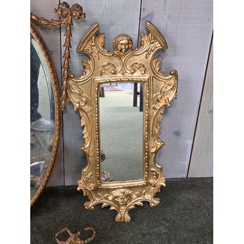 310 - Four decorative gilt wall mirrors