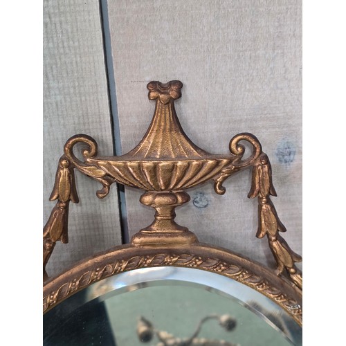 310 - Four decorative gilt wall mirrors