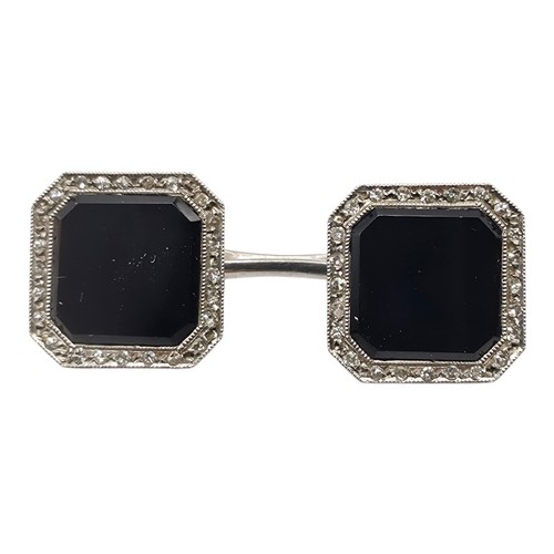 91 - A pair of platinum black onyx and single cut diamond double sided octagonal shaped cufflinks togethe... 