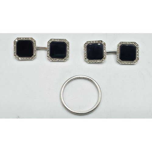 91 - A pair of platinum black onyx and single cut diamond double sided octagonal shaped cufflinks togethe... 