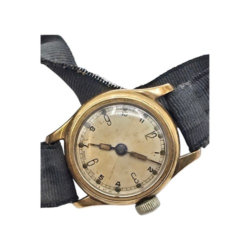 92 - A 9ct gold cased wrist watch 20 mm face with Arabic markers on a fabric strap, gross weight 13 g