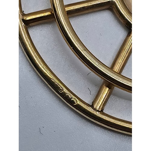 93 - A 9ct gold open work pendant with central circular engraved plate 