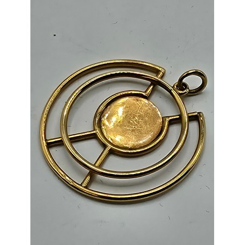 93 - A 9ct gold open work pendant with central circular engraved plate 
