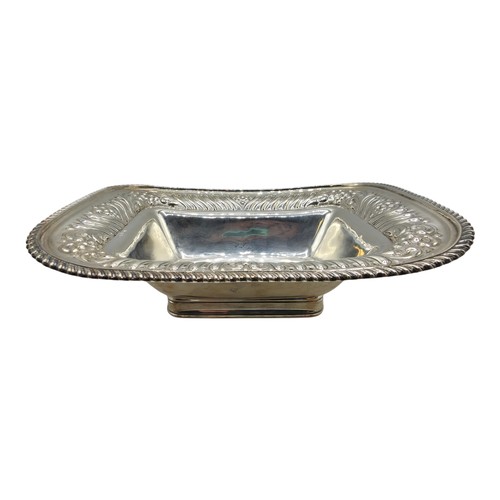 118 - A sterling silver serving dish with repousse decoration and beaded rim by Henry Atkin Sheffield 1894... 