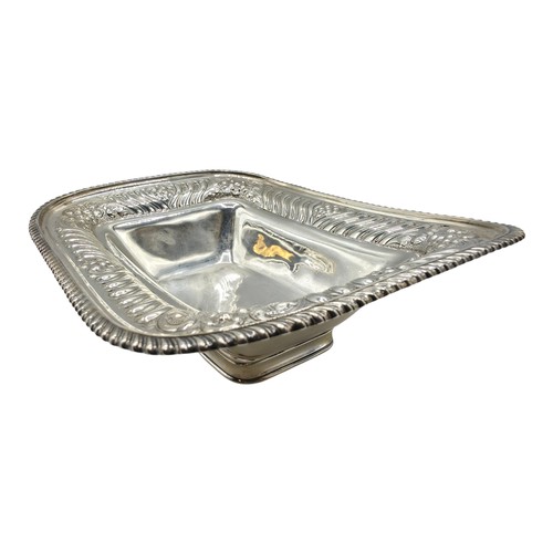 118 - A sterling silver serving dish with repousse decoration and beaded rim by Henry Atkin Sheffield 1894... 