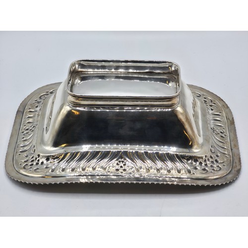 118 - A sterling silver serving dish with repousse decoration and beaded rim by Henry Atkin Sheffield 1894... 