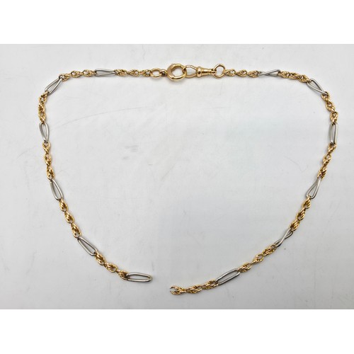 112 - Two unmarked yellow and white metal bracelets 20 cm and 21 cm, 20 g