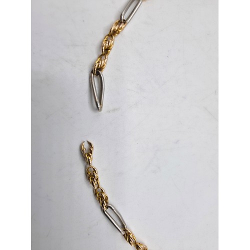 112 - Two unmarked yellow and white metal bracelets 20 cm and 21 cm, 20 g