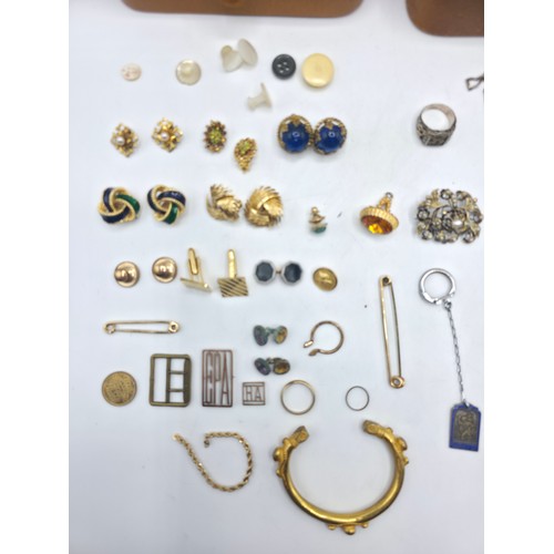 85 - A collection of yellow and white metal items to include costume jewellery , pocket watch, sterling s... 