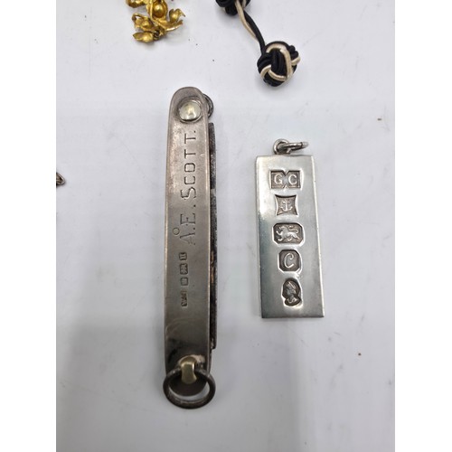 85 - A collection of yellow and white metal items to include costume jewellery , pocket watch, sterling s... 