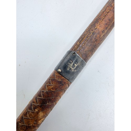 261 - A brown leather sporting stick, with hallmarked silver collar marked Swaine Adeney and bears indisti... 