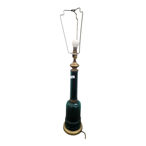 381 - A Victorian emerald glass and brass bound bottle shaped table lamp. 50cm.