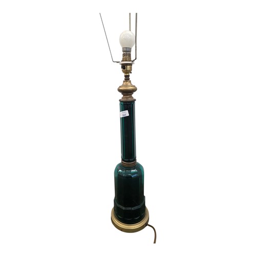 381 - A Victorian emerald glass and brass bound bottle shaped table lamp. 50cm.