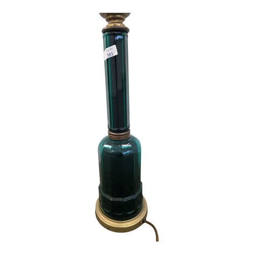381 - A Victorian emerald glass and brass bound bottle shaped table lamp. 50cm.