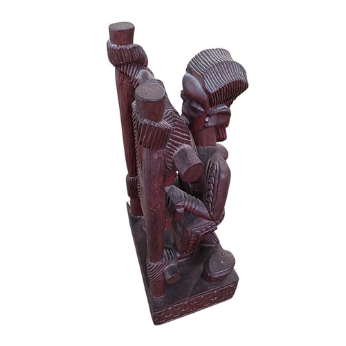 351 - Three West African hardwood sculptures stylised Weaver and two carved hardwood wall hangings, one ma... 