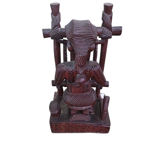 351 - Three West African hardwood sculptures stylised Weaver and two carved hardwood wall hangings, one ma... 