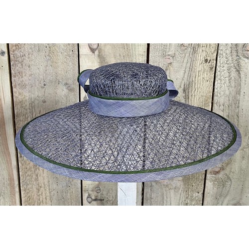 266 - A bespoke Rachel Trevor Morgan, London, sky blue fine mesh straw hat, with green flower and daisy tr... 