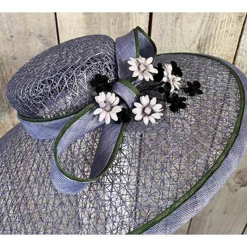 266 - A bespoke Rachel Trevor Morgan, London, sky blue fine mesh straw hat, with green flower and daisy tr... 