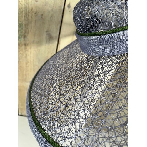 266 - A bespoke Rachel Trevor Morgan, London, sky blue fine mesh straw hat, with green flower and daisy tr... 
