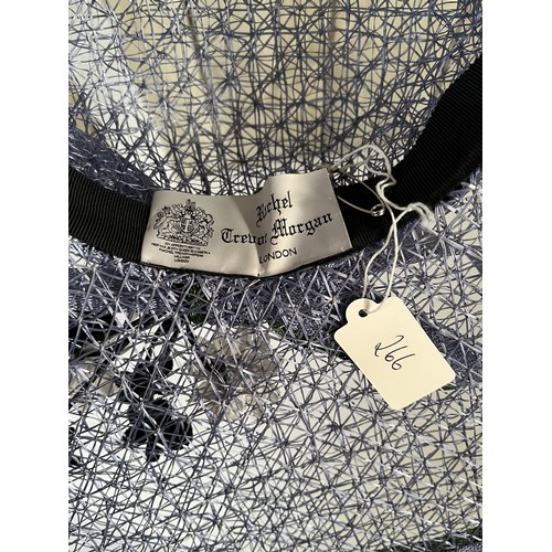 266 - A bespoke Rachel Trevor Morgan, London, sky blue fine mesh straw hat, with green flower and daisy tr... 