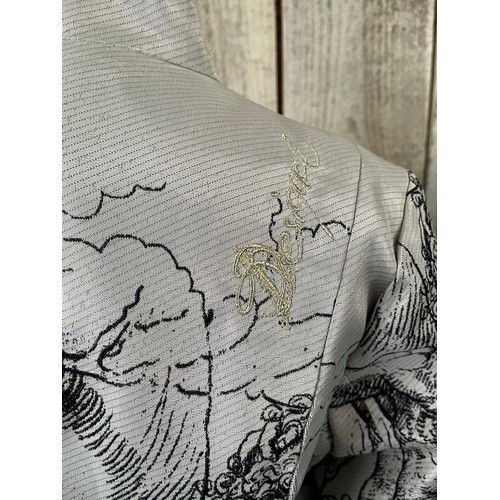 284 - A Desigual printed ladies three quarter length frock coat, with ornate buttons, label size 42cm, in ... 
