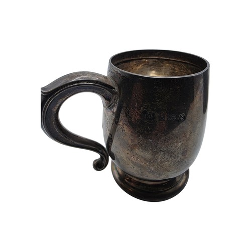 36 - Three sterling silver items , a mug, a christening cup and a pair of wishbone sugar tongs , various ... 
