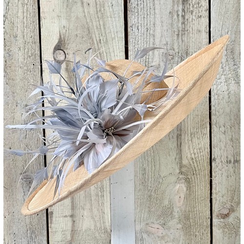 293 - A bespoke Rachel Trevor Morgan, London, natural fine straw hat, sidesweep with grey feather trimming... 