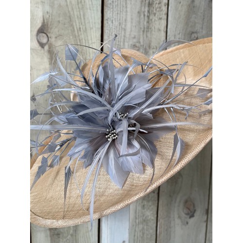 293 - A bespoke Rachel Trevor Morgan, London, natural fine straw hat, sidesweep with grey feather trimming... 