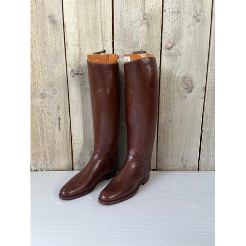 255 - A pair of brown leather Gents riding boots,  sole measures 29cm, with wooden trees. Condition, in us... 