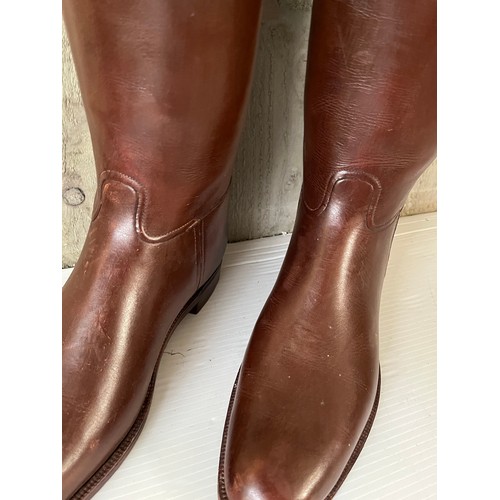 255 - A pair of brown leather Gents riding boots,  sole measures 29cm, with wooden trees. Condition, in us... 