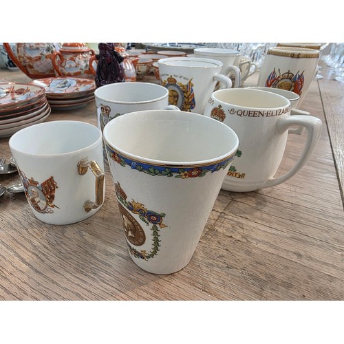 476 - A Japanese egg shell porcelain tea set and commemorative mugs.