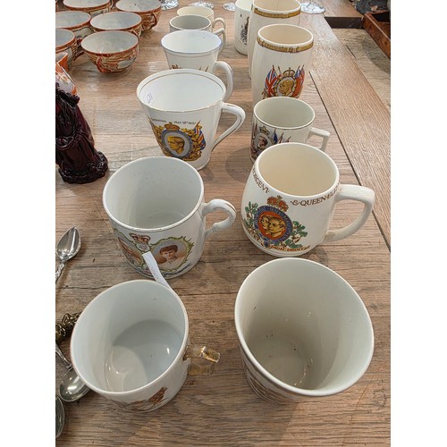 476 - A Japanese egg shell porcelain tea set and commemorative mugs.