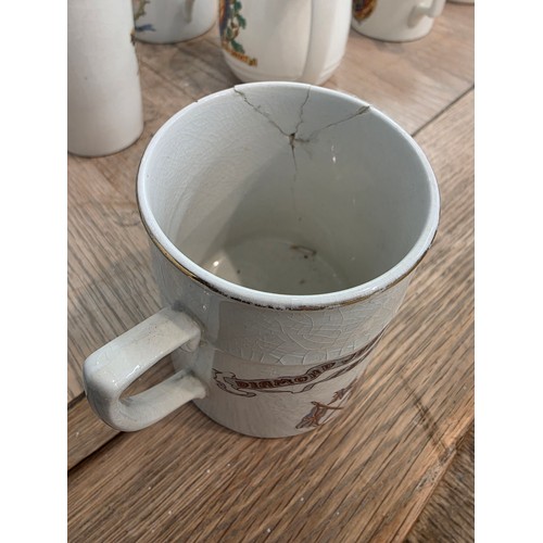 476 - A Japanese egg shell porcelain tea set and commemorative mugs.