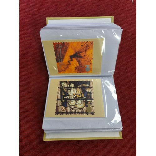 489 - A album collection of Millennium related first day covers together with millennium related postcards... 