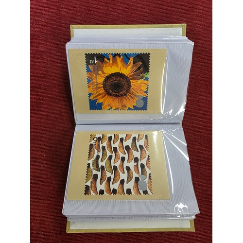 489 - A album collection of Millennium related first day covers together with millennium related postcards... 